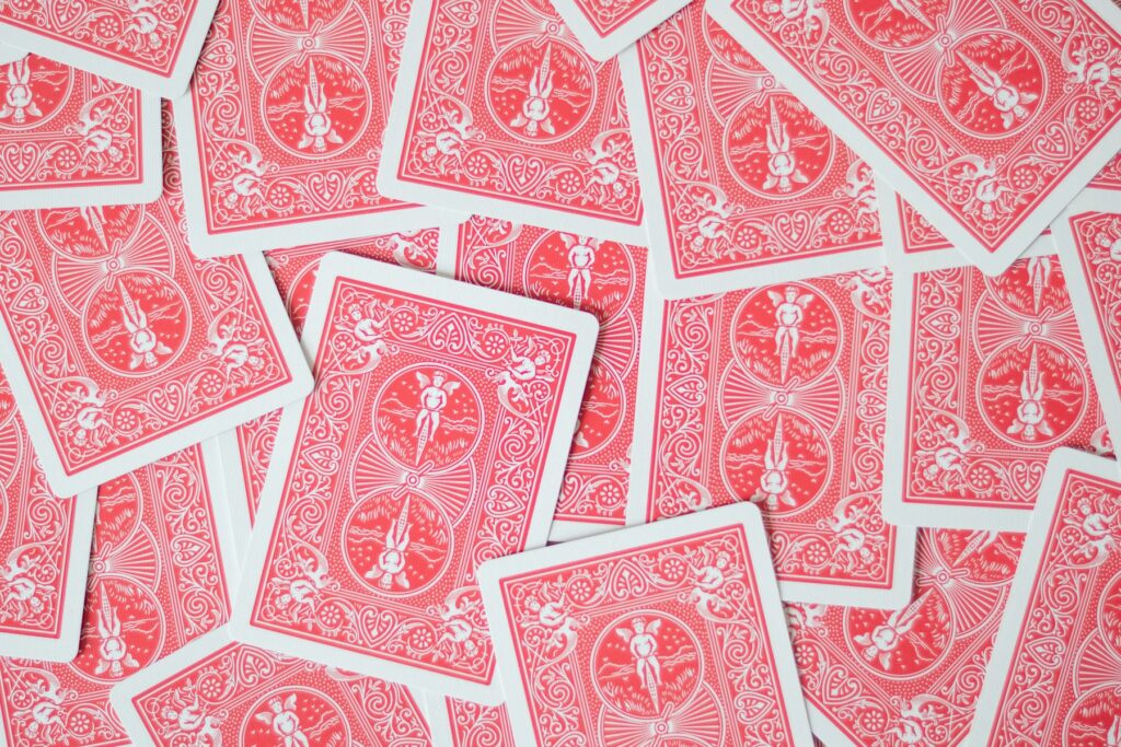 A pile of red and white playing cards